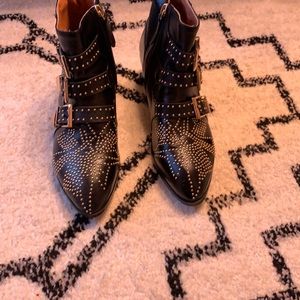 Black boots with gold detail